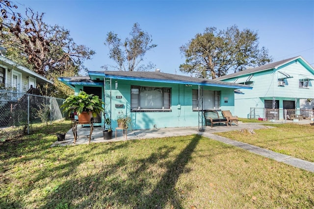 back of property featuring a yard and a patio area