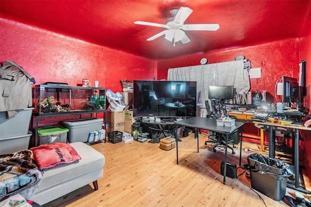 office area with ceiling fan and wood-type flooring