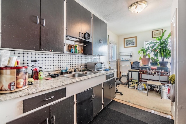 kitchen with sink and a textured ceiling