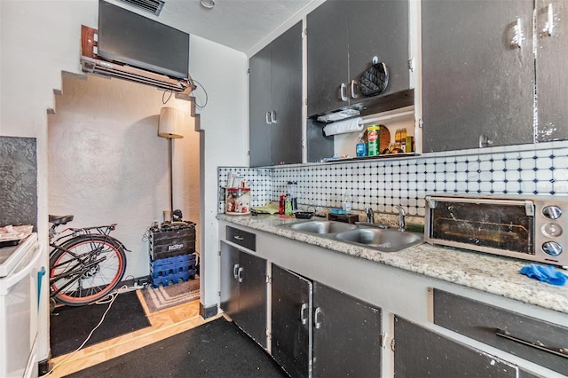 kitchen with sink and decorative backsplash