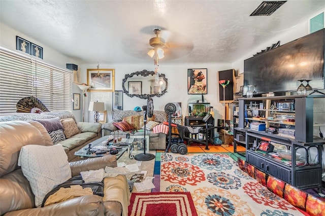 living room with ceiling fan and light hardwood / wood-style floors