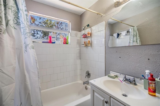 bathroom featuring vanity and shower / bathtub combination with curtain