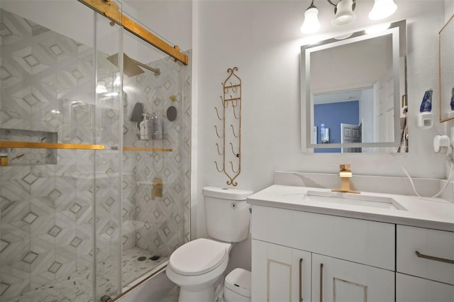 bathroom with vanity, toilet, and walk in shower