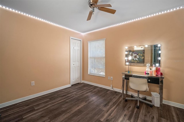 home office with ceiling fan and dark hardwood / wood-style flooring