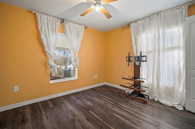 interior space featuring dark hardwood / wood-style flooring and ceiling fan