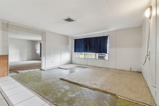 spare room featuring a textured ceiling