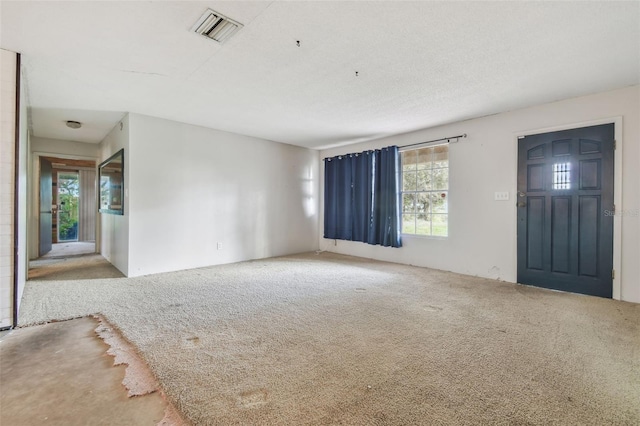 unfurnished living room featuring carpet floors