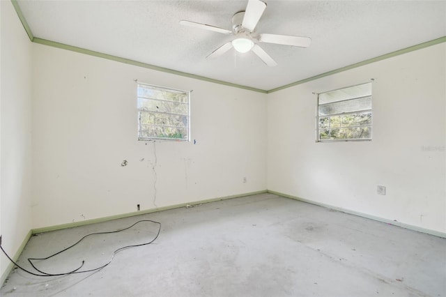 spare room featuring ceiling fan and a textured ceiling