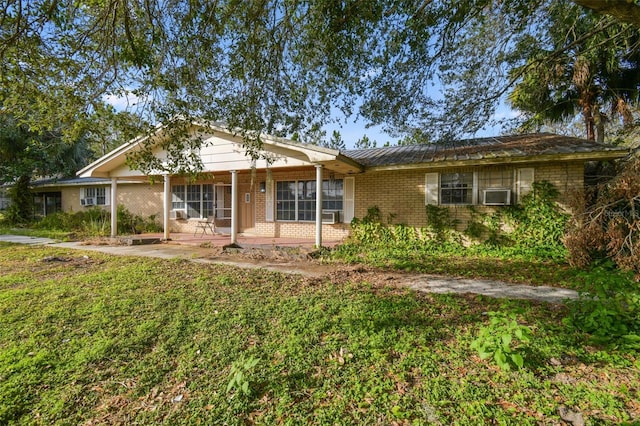 ranch-style home with a patio and a front lawn