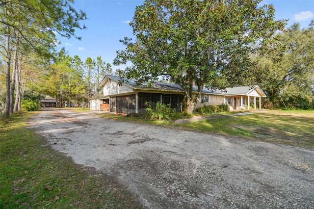 view of front facade featuring a sunroom