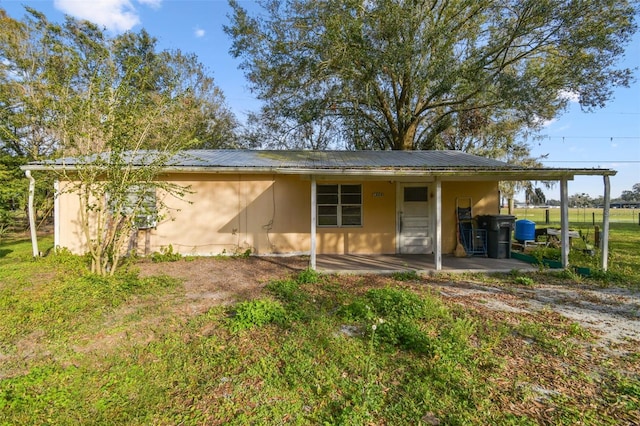 back of house with a patio area