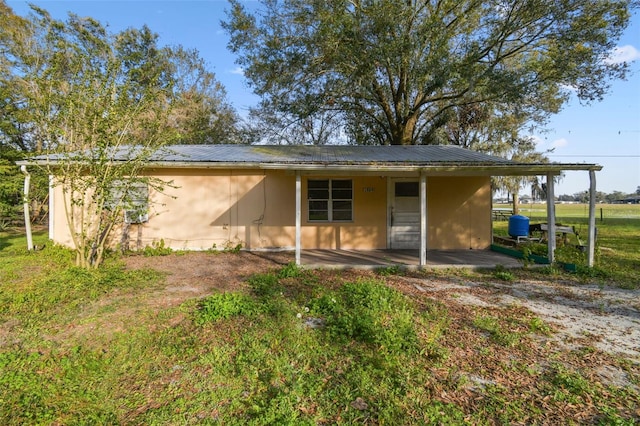 back of property featuring a patio