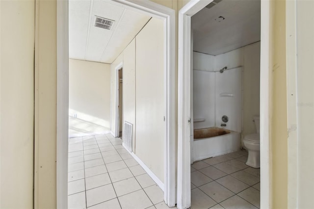 hallway featuring light tile patterned floors