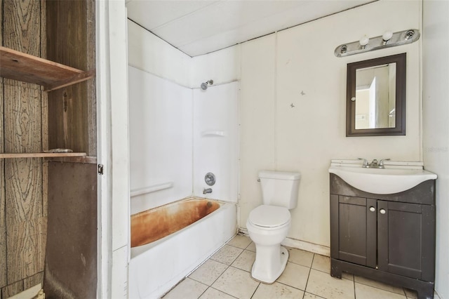 full bathroom with tile patterned floors, toilet,  shower combination, and vanity