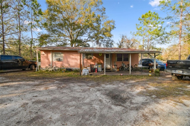 single story home with a carport