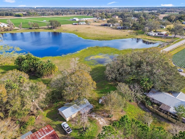 drone / aerial view featuring a water view and a rural view