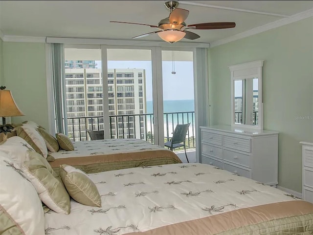 bedroom with multiple windows, ornamental molding, a water view, and access to exterior