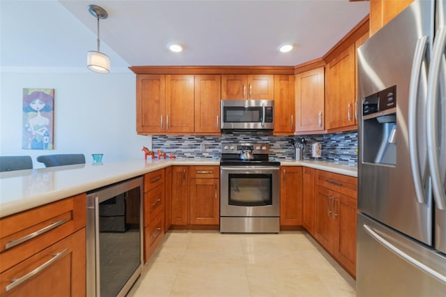 kitchen with wine cooler, pendant lighting, stainless steel appliances, and decorative backsplash