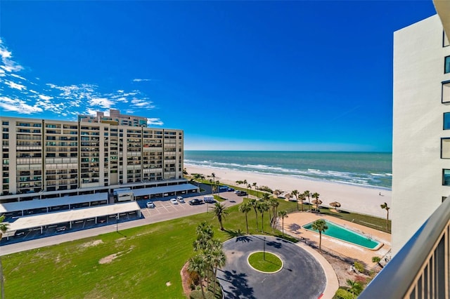 aerial view featuring a view of the beach and a water view