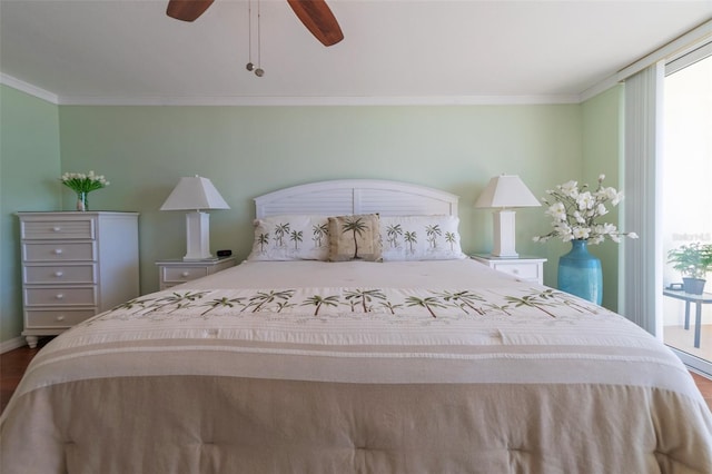 bedroom featuring ornamental molding, hardwood / wood-style floors, and ceiling fan