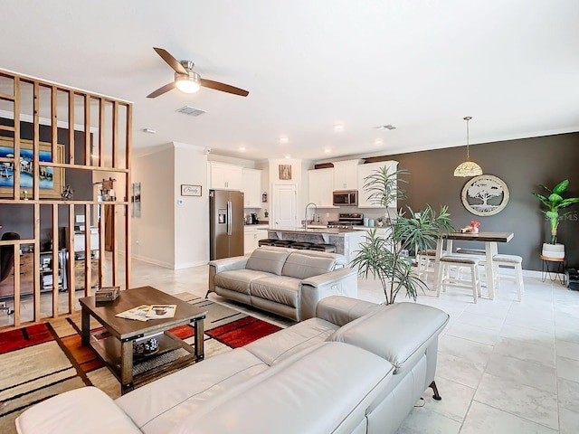 living room with sink and ceiling fan