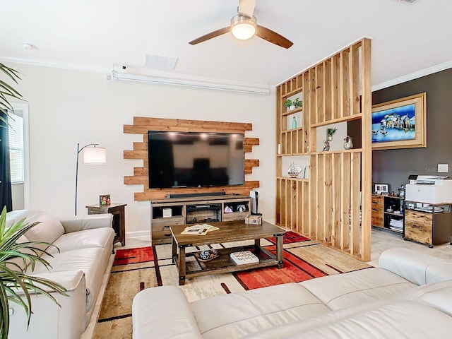 living room featuring ceiling fan and ornamental molding