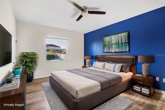 bedroom featuring ceiling fan and light wood-type flooring