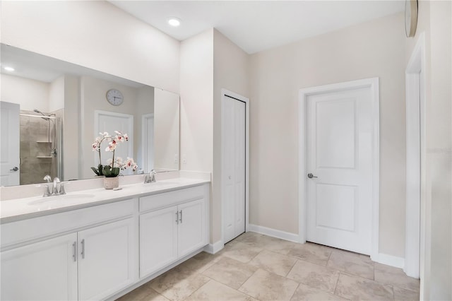 bathroom with vanity and a shower with shower door