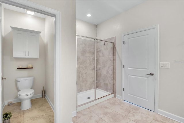 bathroom with walk in shower, tile patterned floors, and toilet