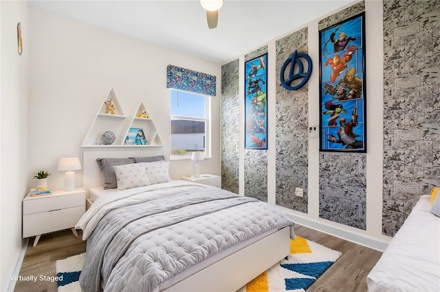 bedroom with hardwood / wood-style flooring and ceiling fan