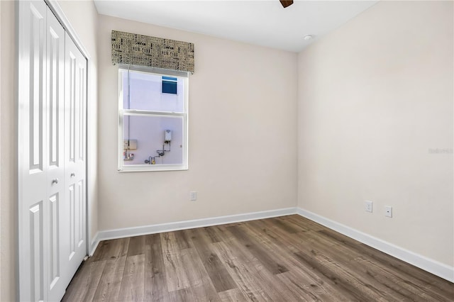 unfurnished room featuring hardwood / wood-style floors and ceiling fan