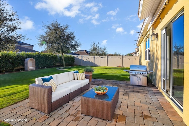 view of patio / terrace with grilling area and an outdoor hangout area