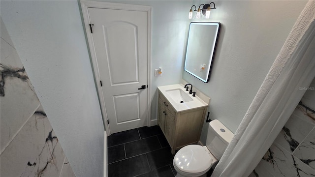 bathroom with vanity and toilet