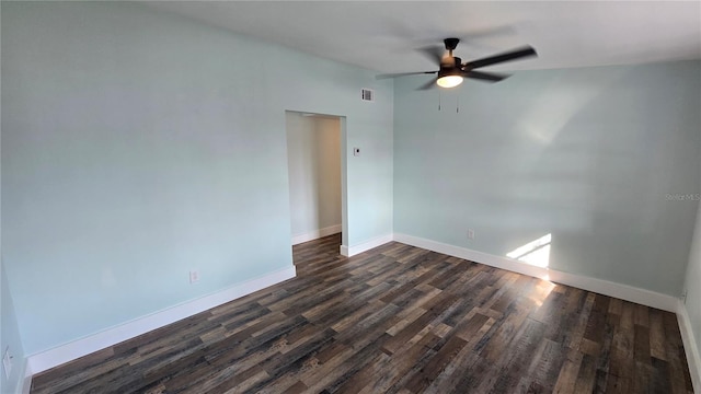 empty room featuring ceiling fan and dark hardwood / wood-style flooring