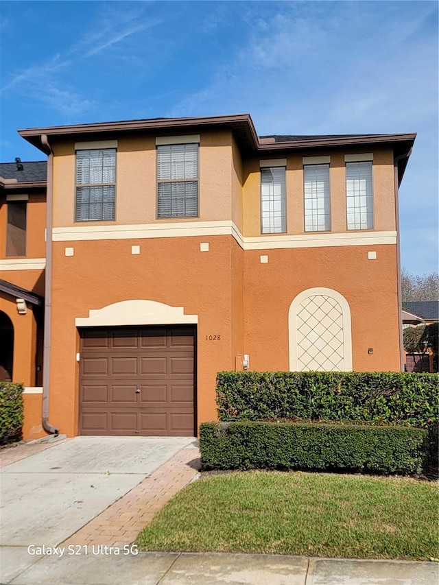 view of front of property with a garage