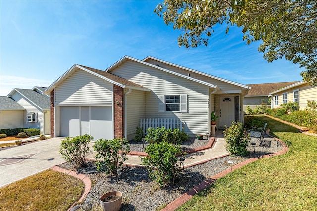 ranch-style home with a garage and a front lawn