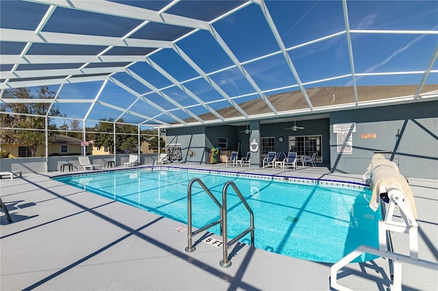 view of swimming pool featuring a patio and ceiling fan