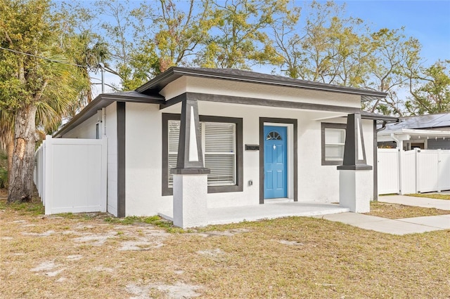 view of front facade with a porch and a front yard