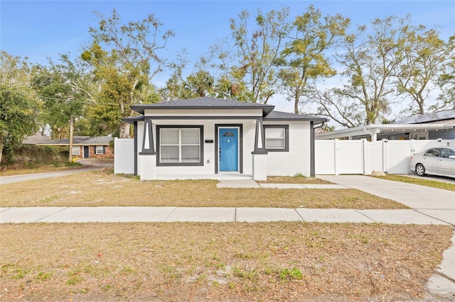 view of front of house with a porch and a front lawn