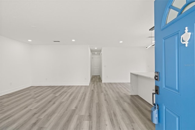 foyer with light wood-type flooring