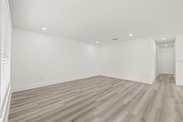 spare room with light hardwood / wood-style floors