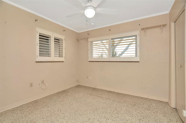 empty room with crown molding and ceiling fan