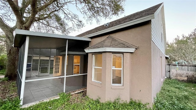 rear view of house with a patio