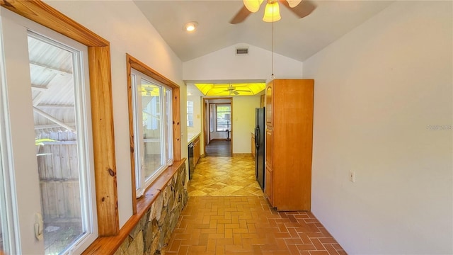 hallway with lofted ceiling