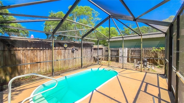 view of pool featuring a lanai and a patio area