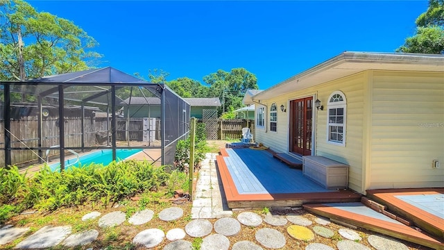 view of swimming pool with a lanai