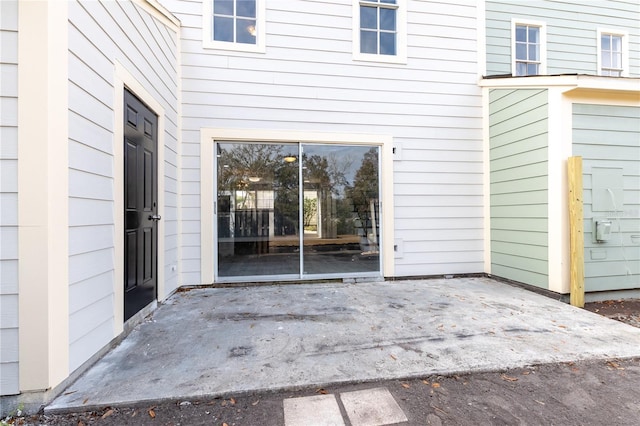 entrance to property featuring a patio