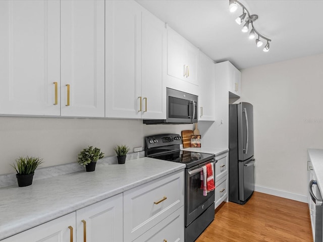 kitchen with stainless steel appliances and white cabinets