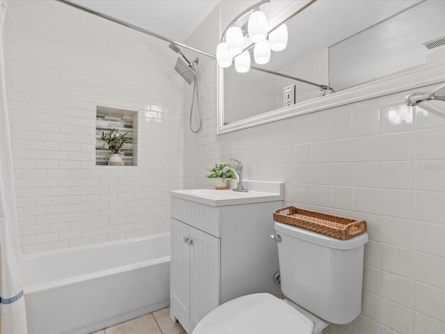 full bathroom featuring tile patterned floors, toilet, tile walls, vanity, and decorative backsplash