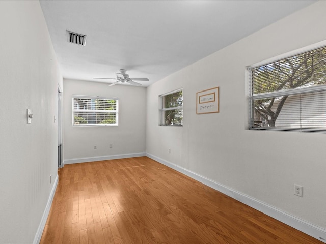 unfurnished room featuring light hardwood / wood-style flooring and ceiling fan